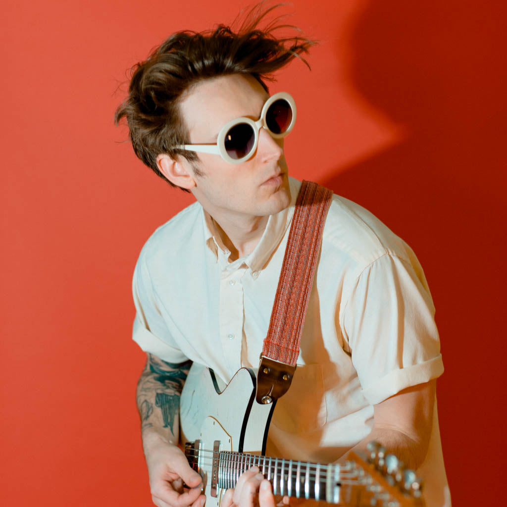 Vintage-style guitar strap made with repurposed vintage red cotton fabric by Original Fuzz.