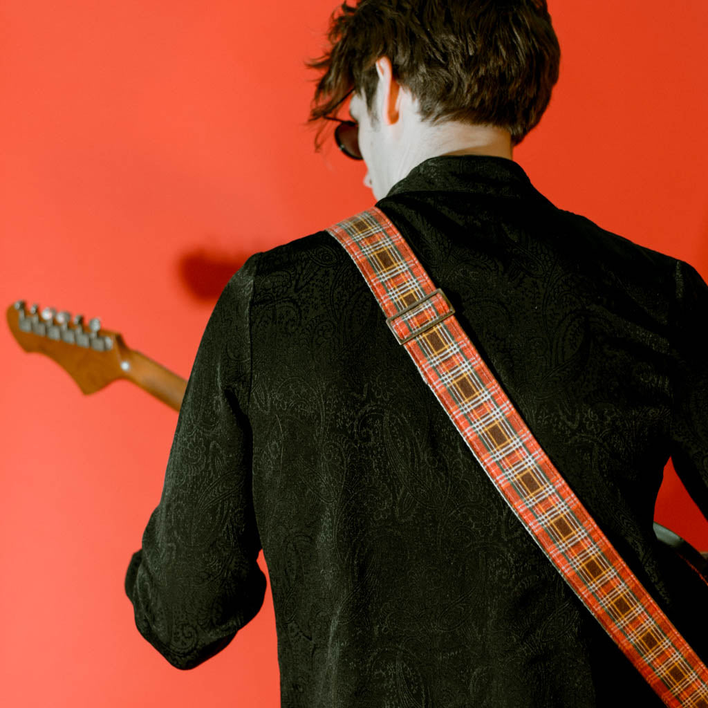 Vintage guitar strap made with repurposed red plaid flannel by Original Fuzz.