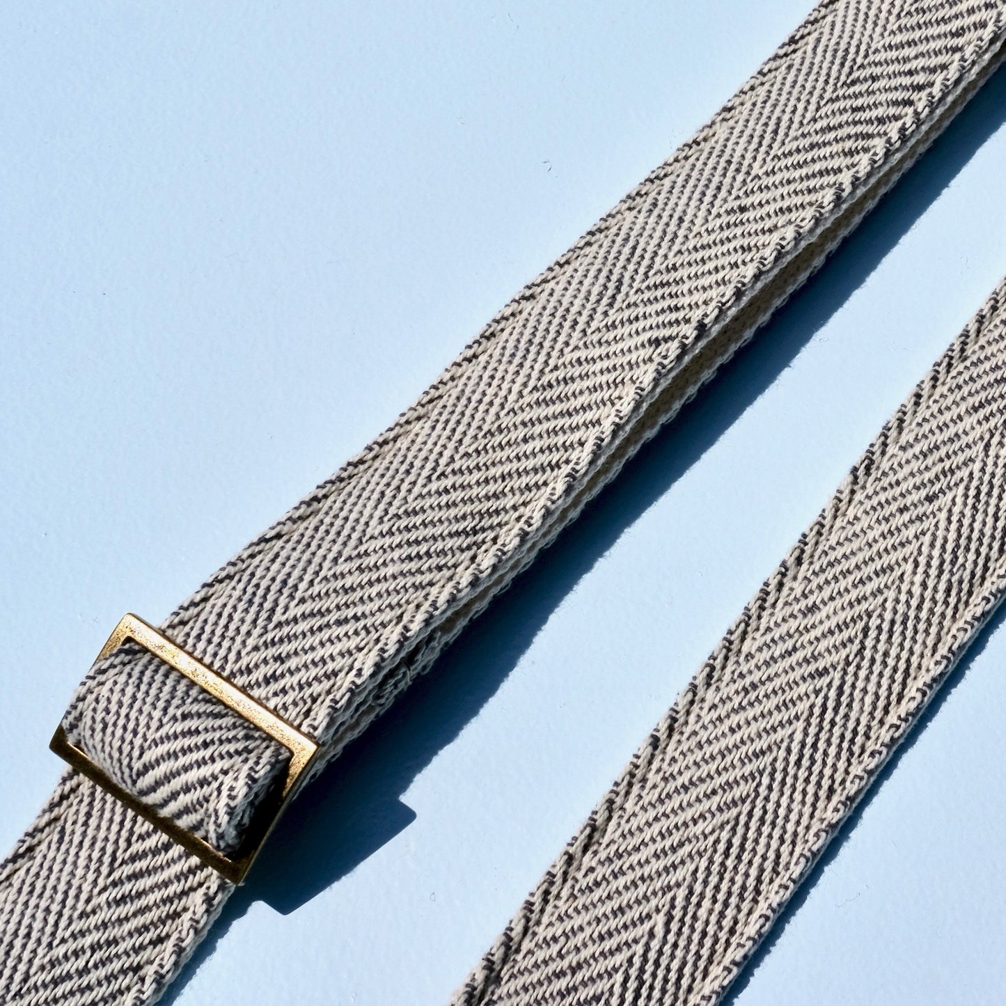 Skinny width black and cream woven guitar strap made in Nashville using fair-trade Indian woven fabric.