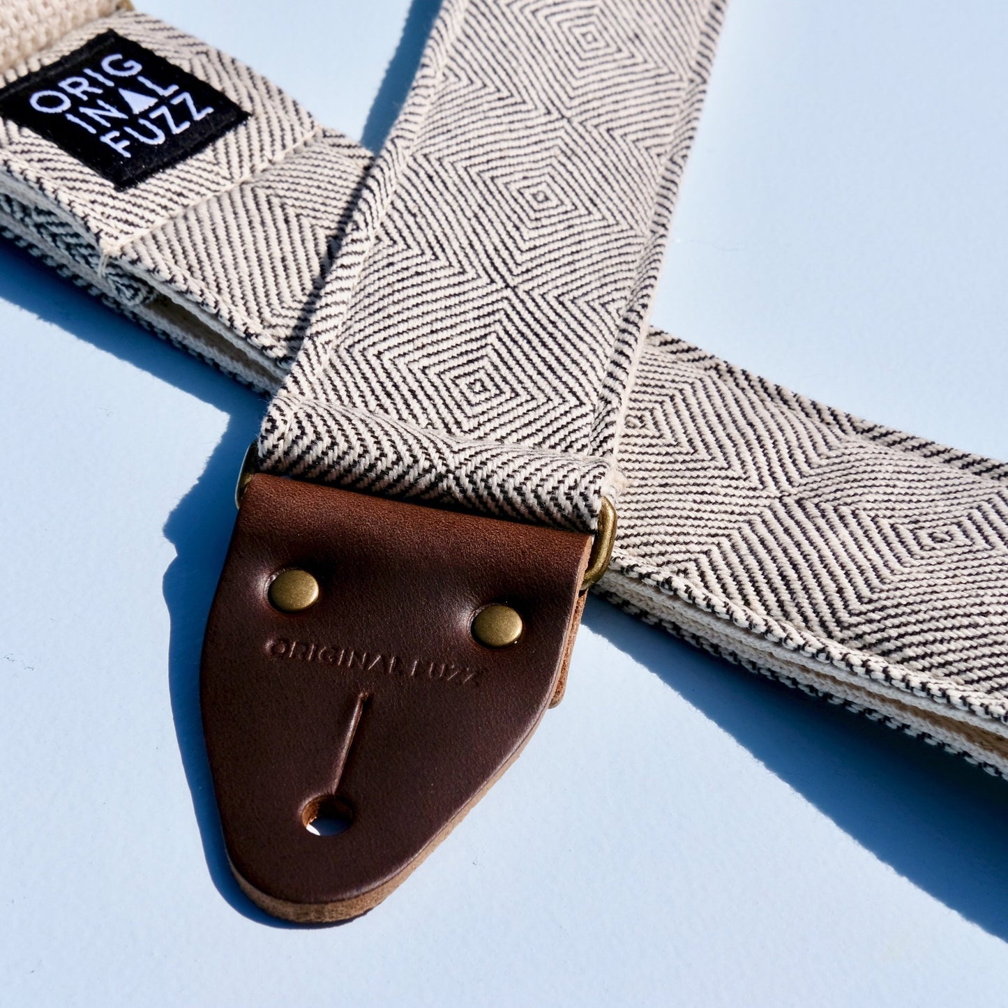 Woven black and cream guitar strap made with imported fair-trade fabric from Indian in Nashville by Original Fuzz.