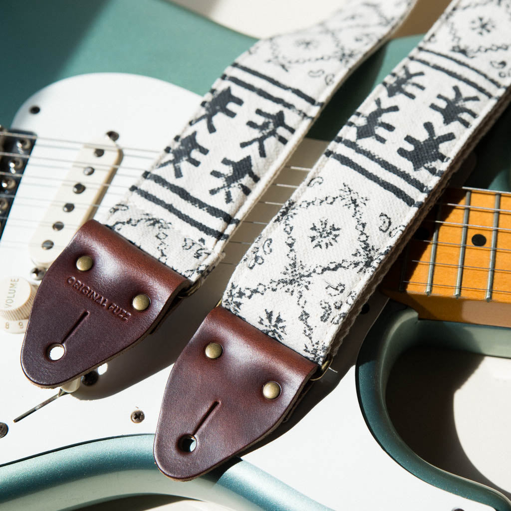 Vintage-style guitar strap made with black ink block-printed on white cotton fabric from India by Original Fuzz on Fender Stratocaster.