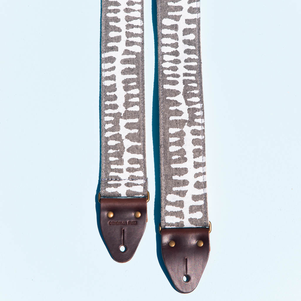 White and gray skeletal spine India block print vintage-style guitar strap by Original Fuzz. 