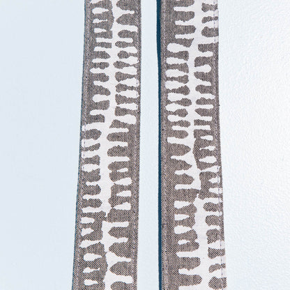 White and gray vintage-style camera strap made with fabric block printed in India by Original Fuzz in Nashville, TN. 