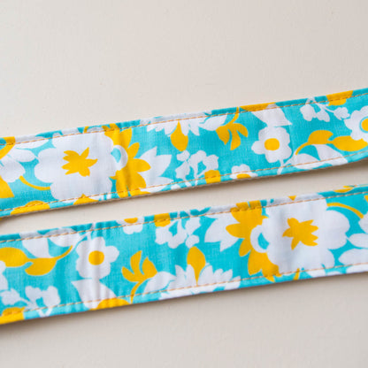 Vintage-style guitar strap made with repurposed light blue and yellow floral cotton by Original Fuzz.