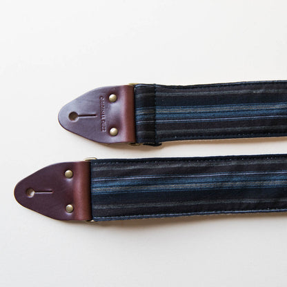 Vintage-style guitar strap made with reclaimed black striped cotton by Original Fuzz.
