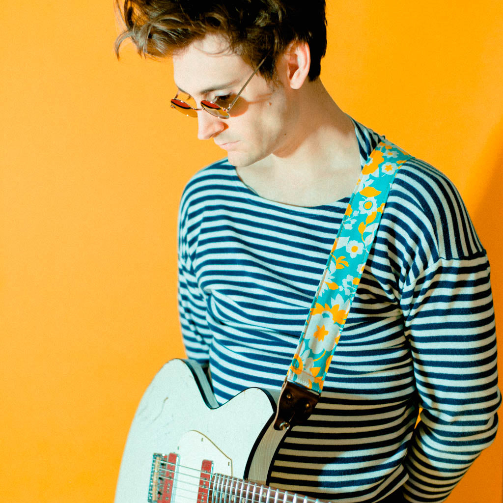 Vintage-style guitar strap made with repurposed light blue and yellow floral cotton by Original Fuzz.