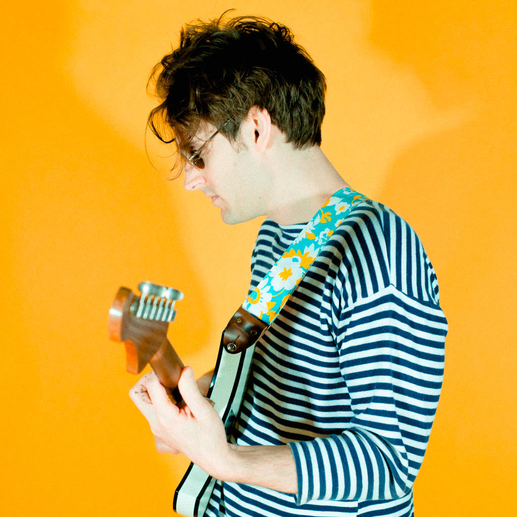 Vintage-style guitar strap made with repurposed light blue and yellow floral cotton by Original Fuzz.