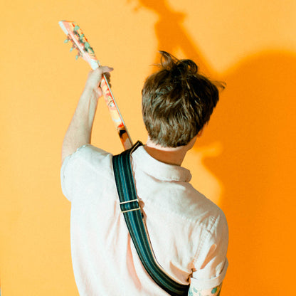 Vintage-style guitar strap made with reclaimed black striped cotton by Original Fuzz.