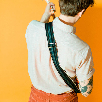 Vintage-style guitar strap made with reclaimed black striped cotton by Original Fuzz.