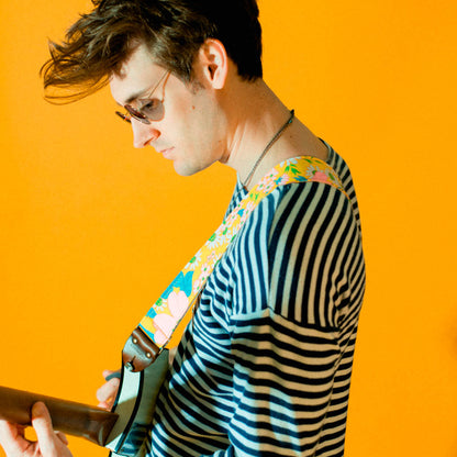 Original Fuzz vintage-style guitar strap made with repurposed yellow floral fabric.