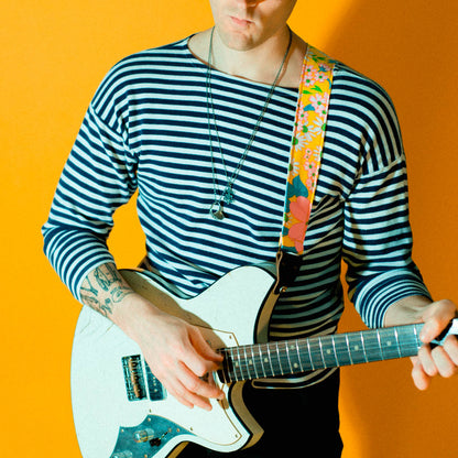 Original Fuzz vintage-style guitar strap made with repurposed yellow floral fabric.