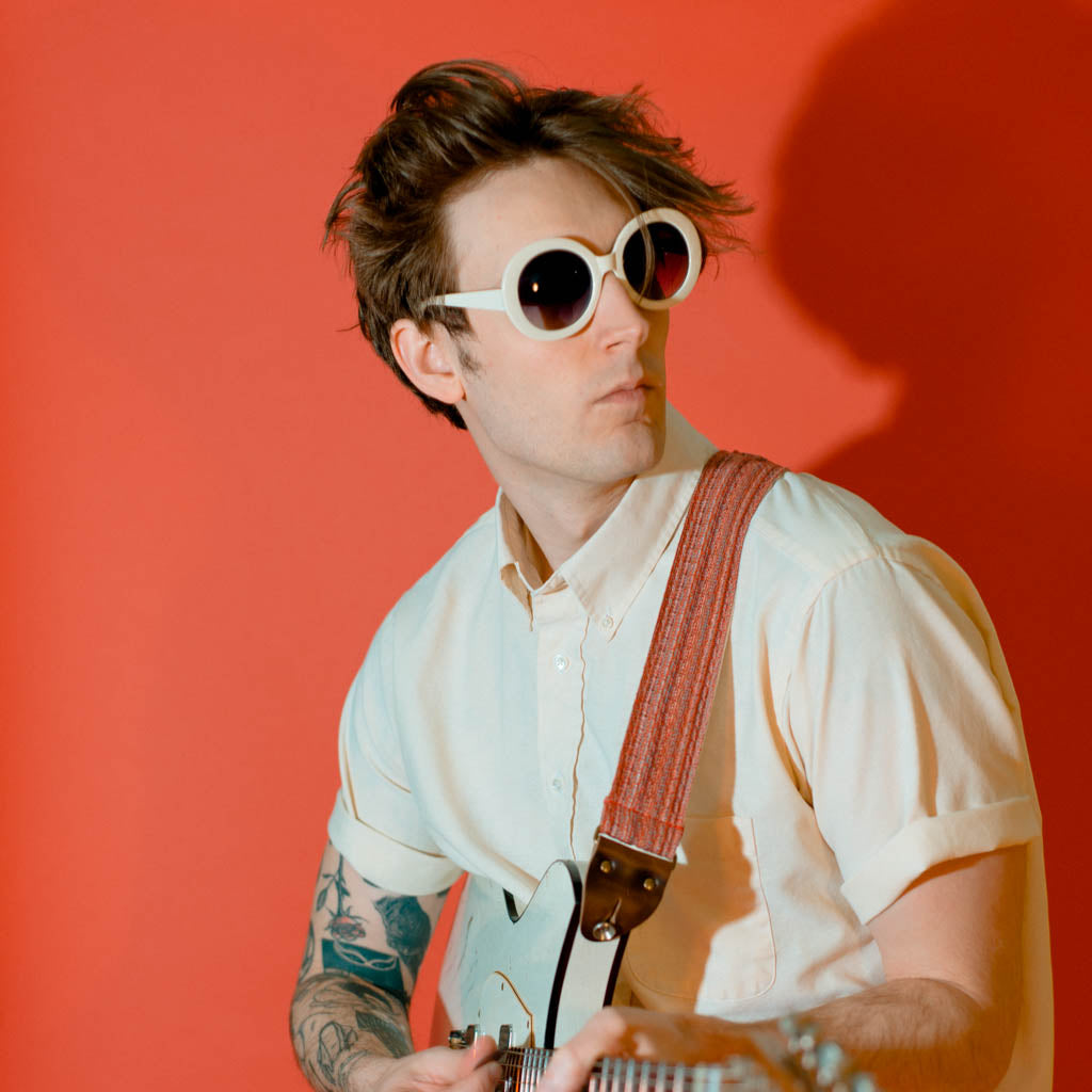Vintage-style guitar strap made with repurposed vintage red cotton fabric by Original Fuzz.