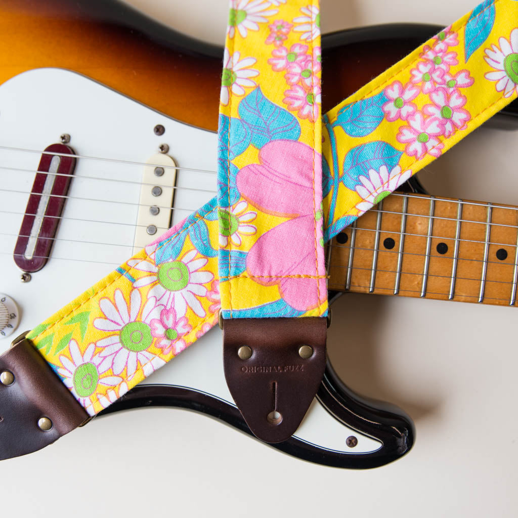 Original Fuzz vintage-style guitar strap made with repurposed yellow floral fabric.