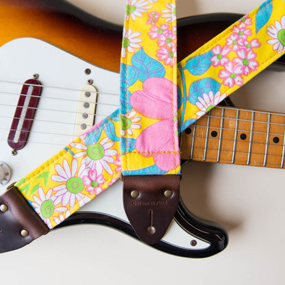 Original Fuzz vintage-style guitar strap made with repurposed yellow floral fabric.