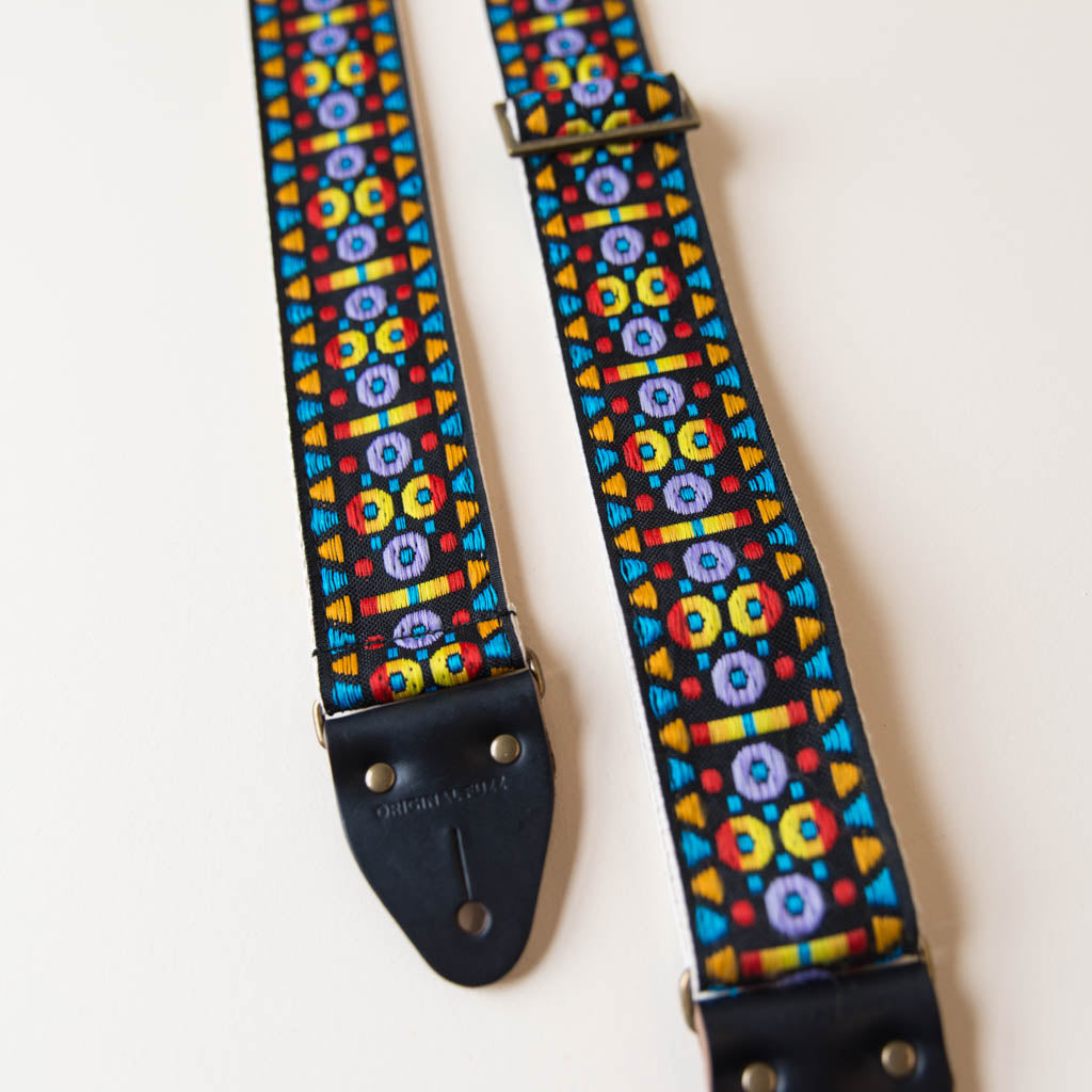 Vintage-style guitar strap made with a 60s style colorful woven jacquard by Original Fuzz.