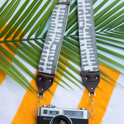 White and gray vintage-style camera strap made with fabric block printed in India by Original Fuzz in Nashville, TN. 