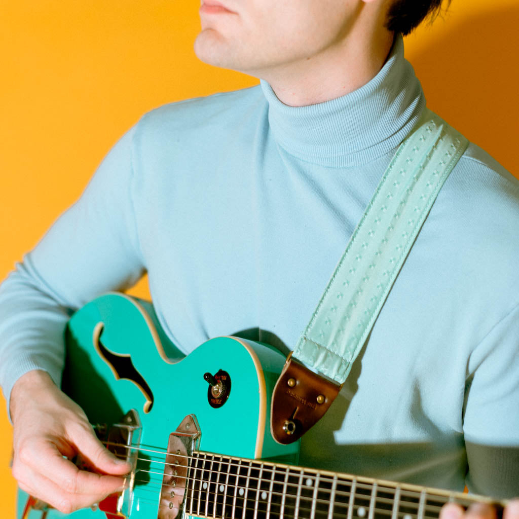 Vintage guitar strap made with light blue satin by Original Fuzz. 
