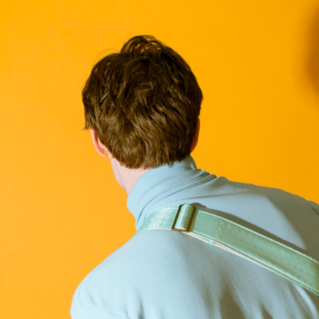 Vintage guitar strap made with light blue satin by Original Fuzz. 