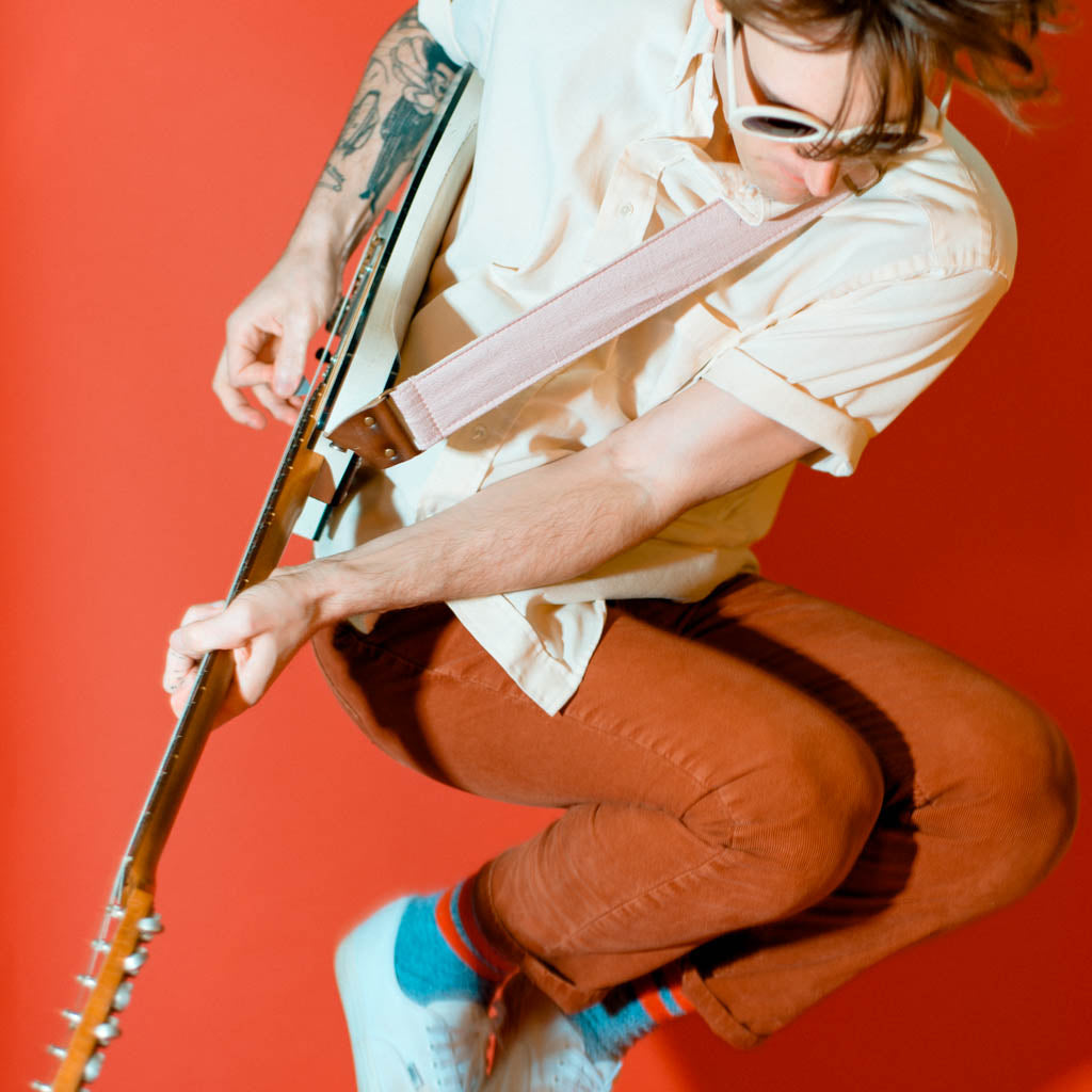 Light pink silk vintage guitar strap made by Original Fuzz. 