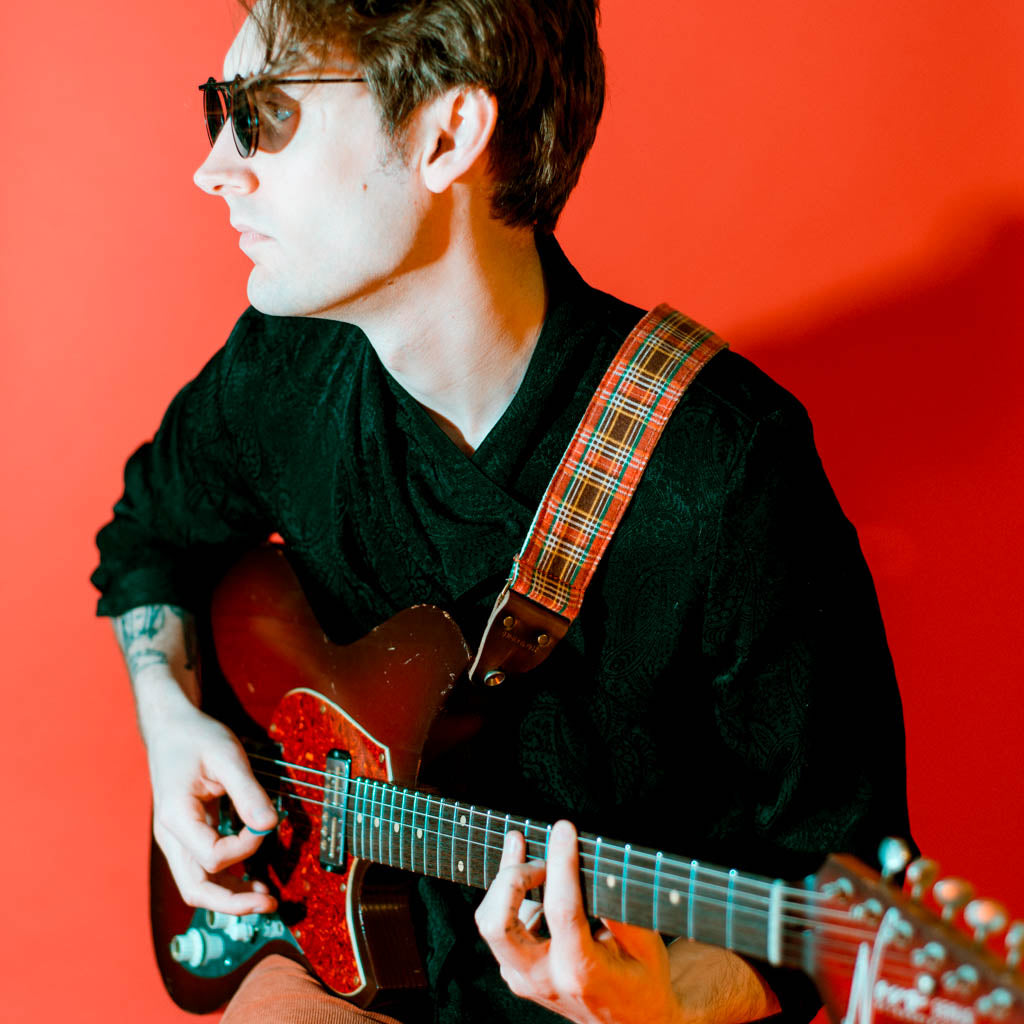 Vintage guitar strap made with repurposed red plaid flannel by Original Fuzz. 