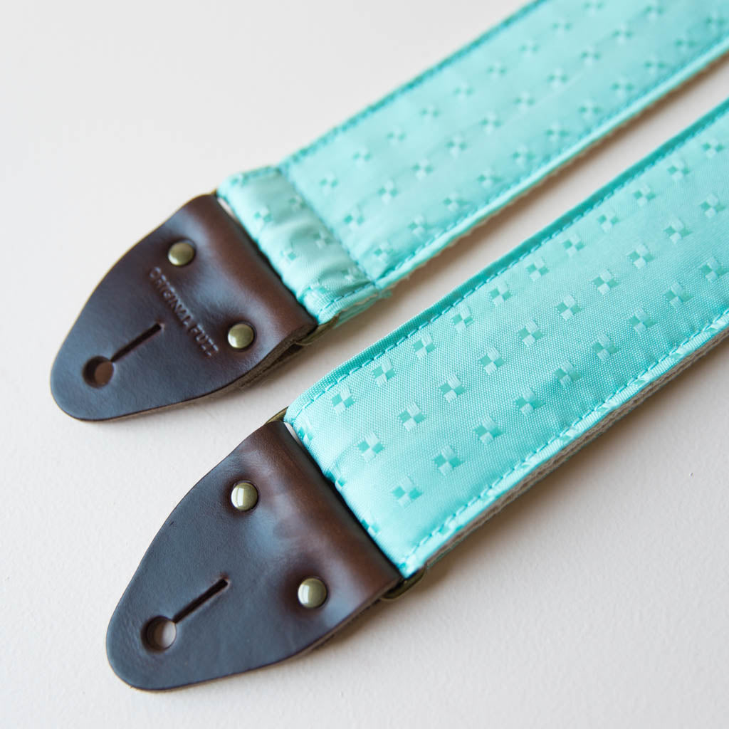 Vintage guitar strap made with light blue satin by Original Fuzz. 