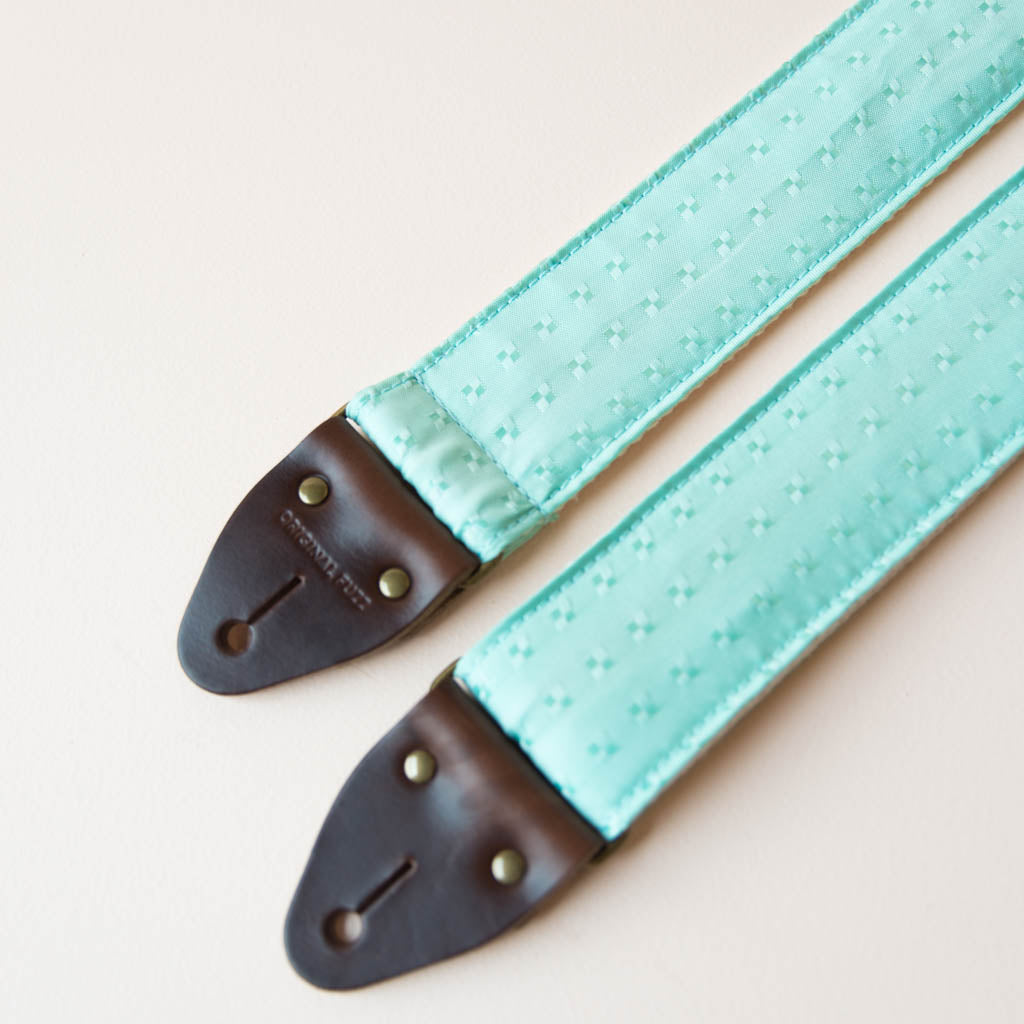Vintage guitar strap made with light blue satin by Original Fuzz. 