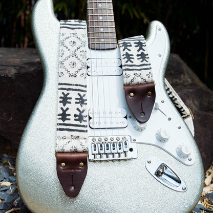 Vintage-style guitar strap made with black ink block-printed on white cotton fabric from India by Original Fuzz on Fender.