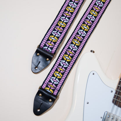 The vintage guitar strap in Everett street with a white Fender Jaguar